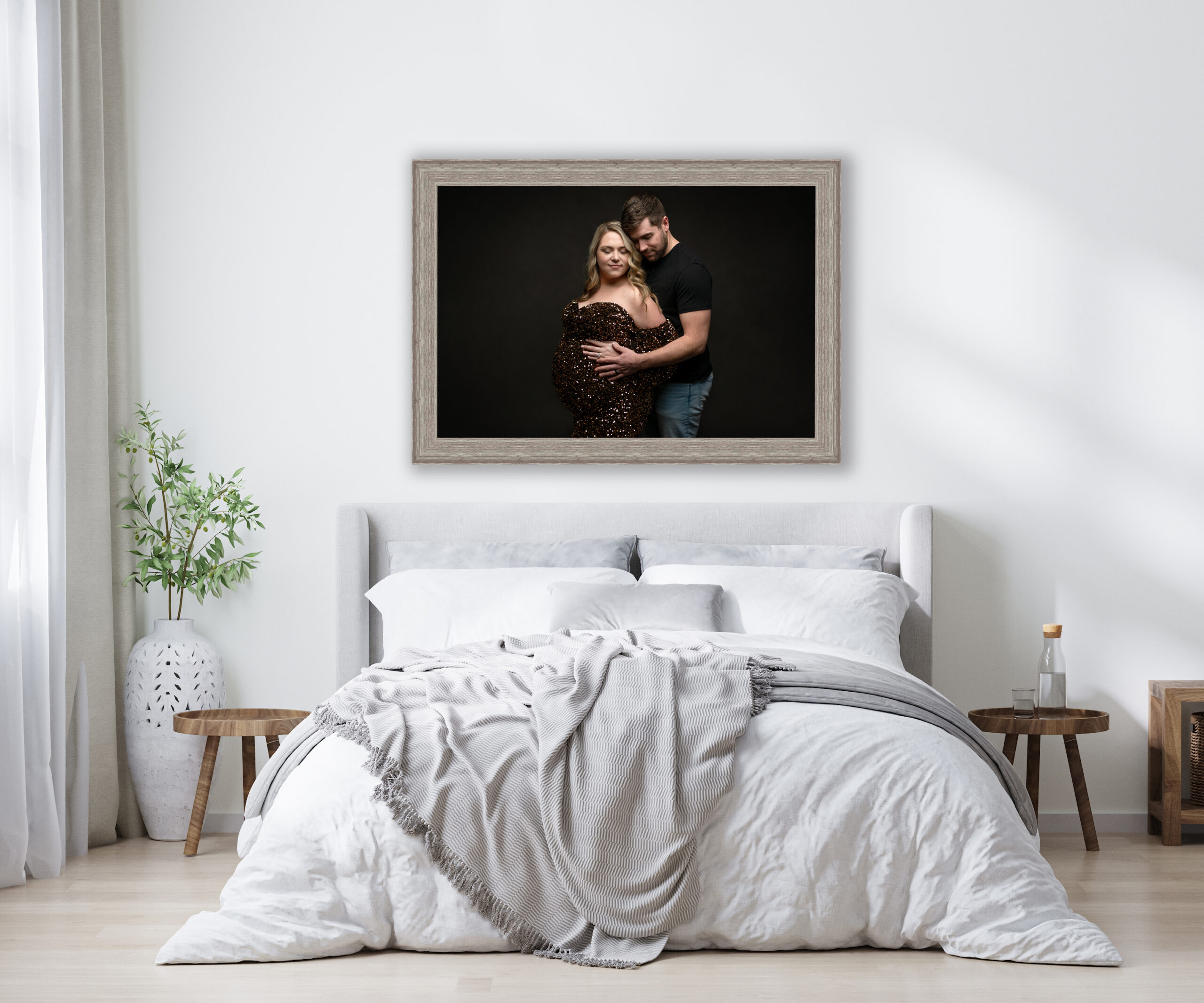 Maternity portrait displayed in a white themed bedroom.