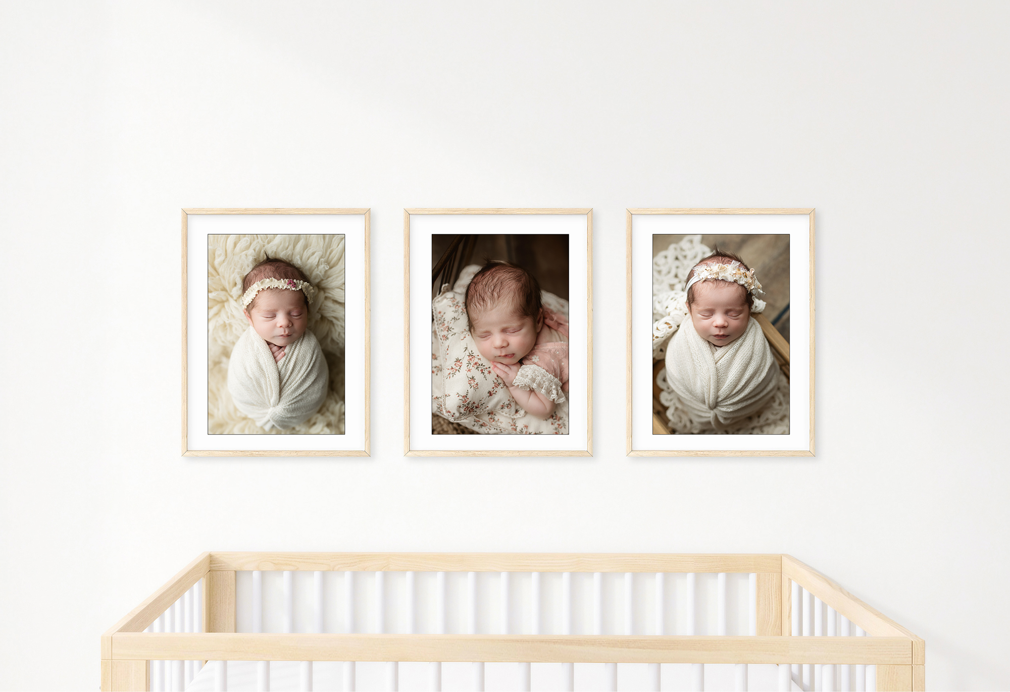 Three portraits hung on a wall above baby's crib.