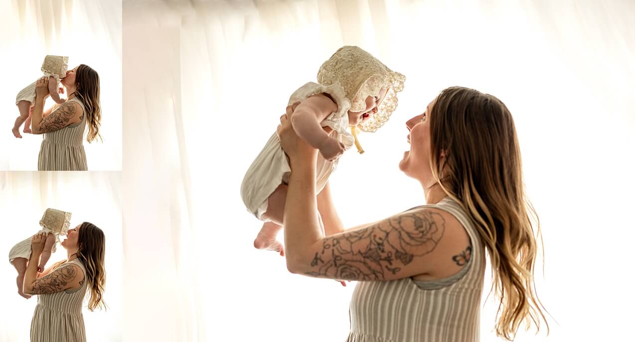 Backlit images of a mom holding up her six month baby girl.