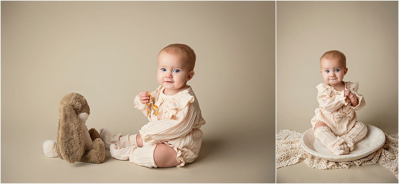 Six month old little girl dressed in a cream romper poses for her milestone session. 