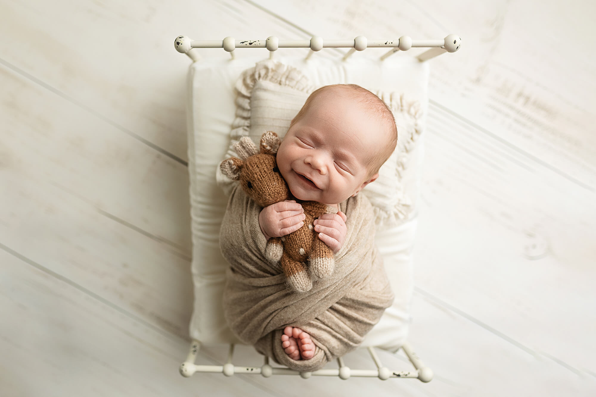 Neutral wrap on a newborn boy during his newborn session.