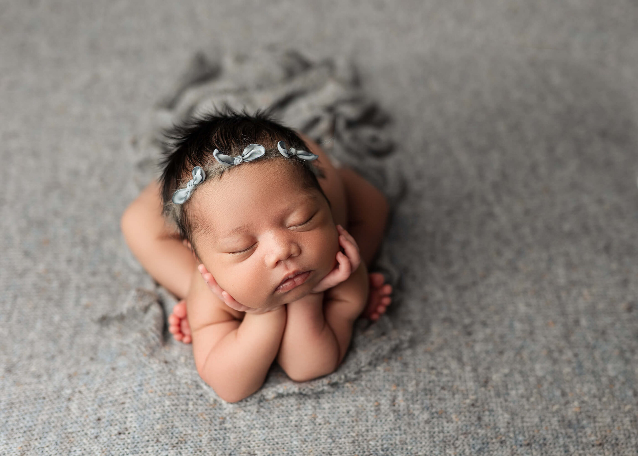 Forggy pose newborn girl on gray backdrop - Mankato MN newborn photographer