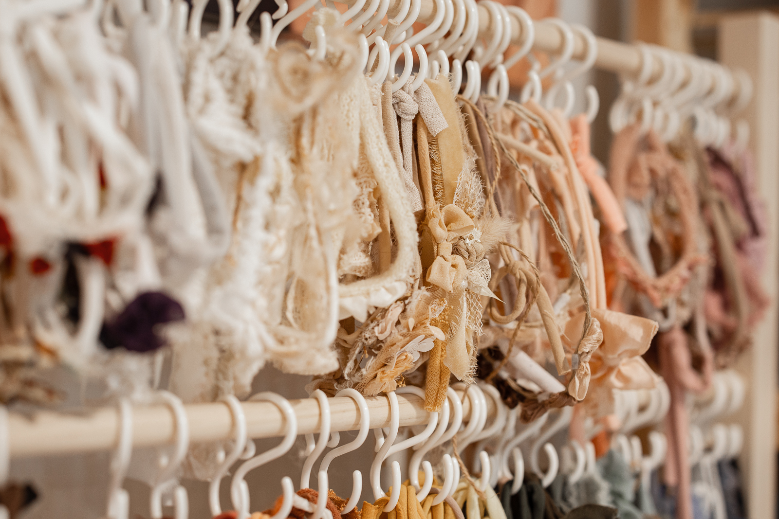 Newborn photography accessories including headbands and bonnets in a Minnesota studio